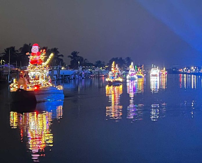 a boat decorated with christmas lights on the water