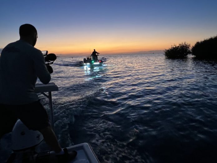Jesse Hayes heads out a couple of people on a boat in the water