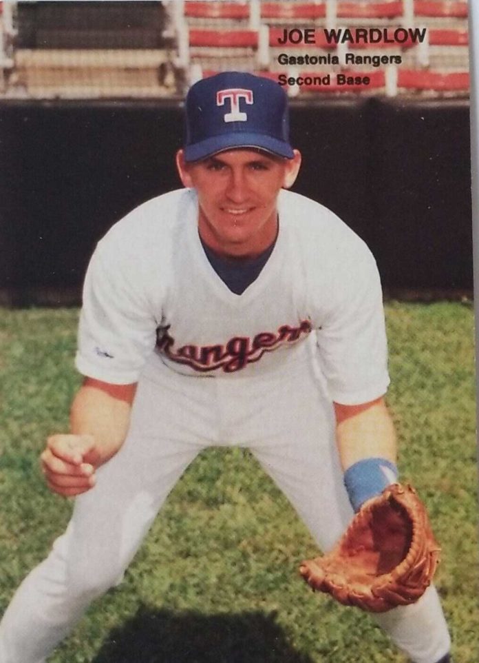 a baseball player is posing for a picture