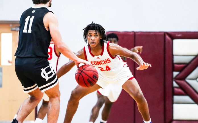 a group of young men playing a game of basketball