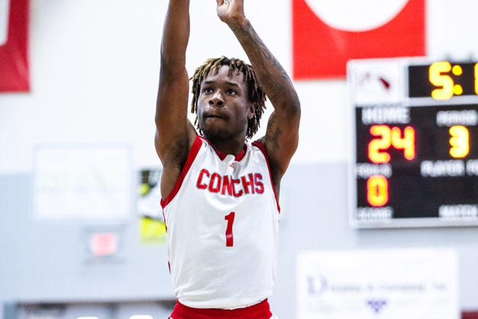 a man in a red and white uniform is playing basketball