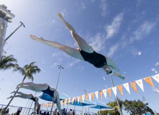 OHIO COLLEGE SWIMMERS WIN ORANGE BOWL CLASSIC IN KEY LARGO a man diving into a swimming pool