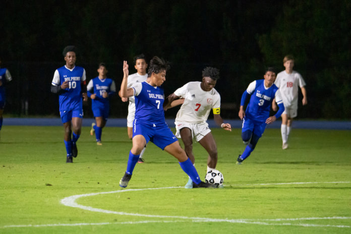 a group of young men playing a game of soccer