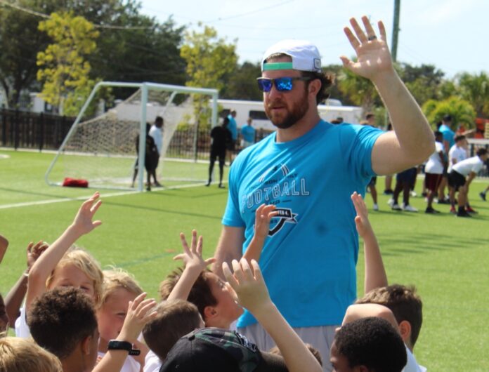 a man standing in front of a crowd of people