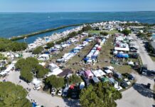 UPPER KEYS ROTARY CLUB’S GIGANTIC NAUTICAL MARKET RETURNS FOR THE 31st YEAR an aerial view of a camp site near the ocean