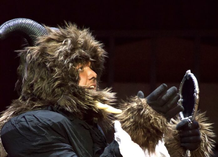 a man dressed in a horned animal costume