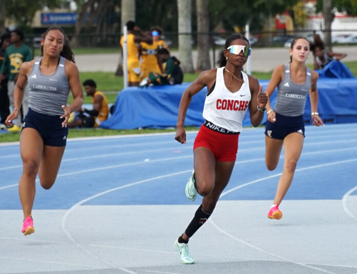 a group of women running on a track