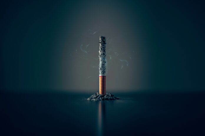 a cigarette with smoke coming out of it