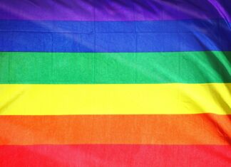 a rainbow flag with a black background