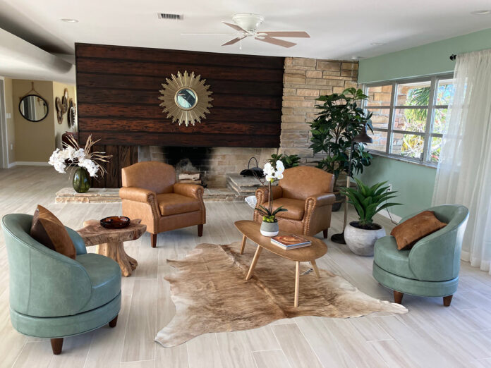 a living room filled with furniture and a fire place