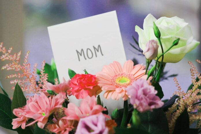 a bouquet of flowers with a note attached to it