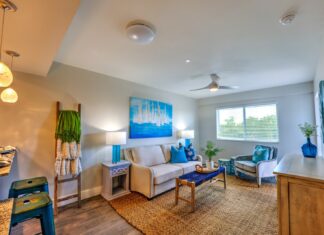 a living room filled with furniture and a flat screen tv