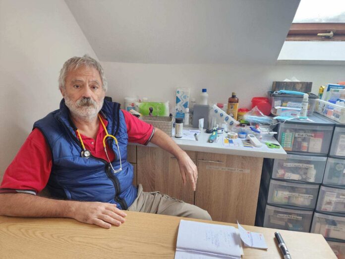 a man sitting at a table in a room
