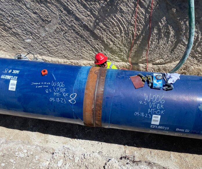 a large blue barrel with writing on it