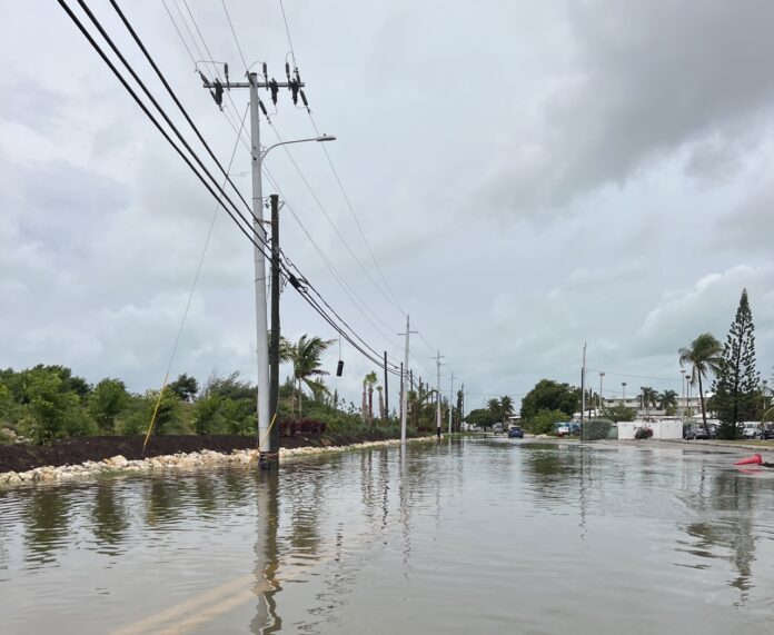a street flooded with water and power lines