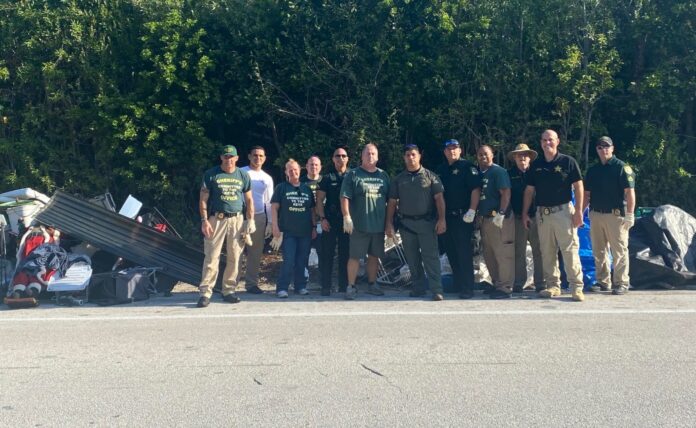 UK illegal dumping a group of people standing on the side of a road