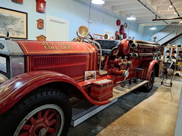 an old fire truck is on display in a museum