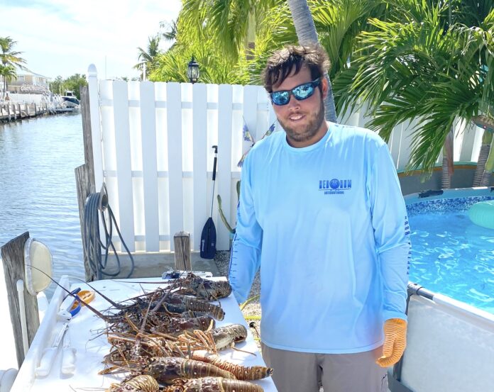 a man standing in front of a table filled with food