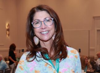 COUNTY COMMISSIONER MICHELLE LINCOLN ELECTED FIRST VP OF FLORIDA ASSOCIATION OF COUNTIES a woman standing in front of a room full of people