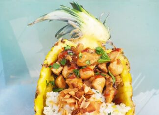a pineapple filled with rice and nuts