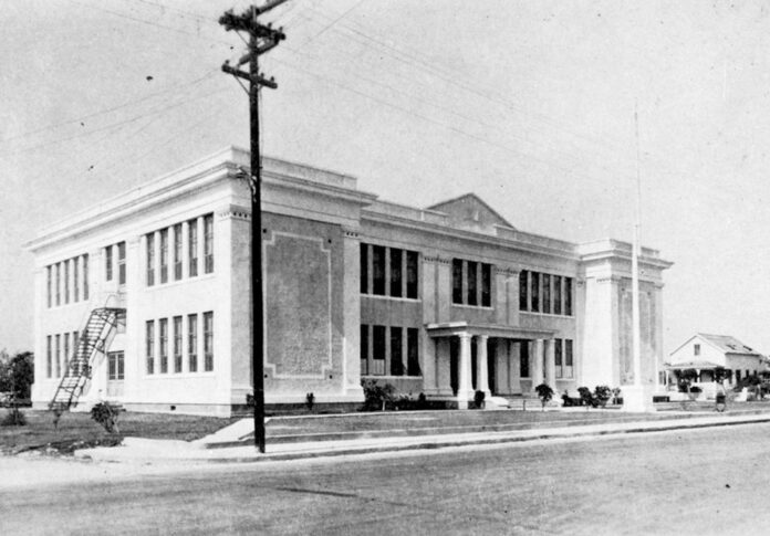 an old black and white photo of a building