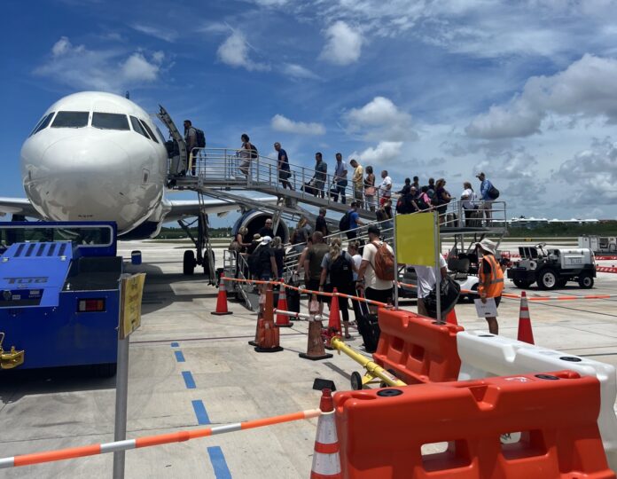 a large jetliner sitting on top of an airport tarmac