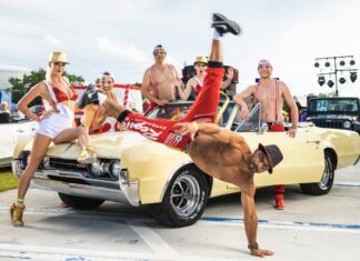 MEET THE PEOPLE BEHIND THE PARADE: THE PASION PROJECT a man doing a handstand on the hood of a car
