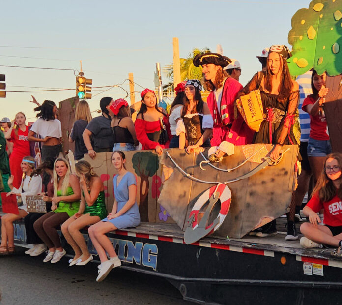 a group of people riding on the back of a truck