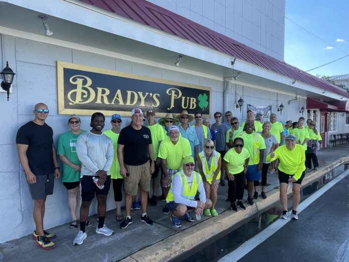 Ploggers at Brady's a group of people standing in front of a building