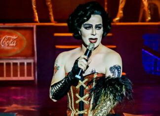 a woman in a costume holding a microphone