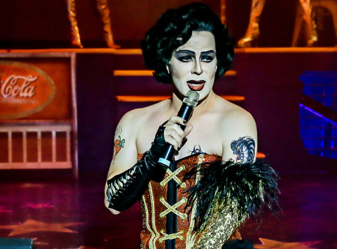 a woman in a costume holding a microphone