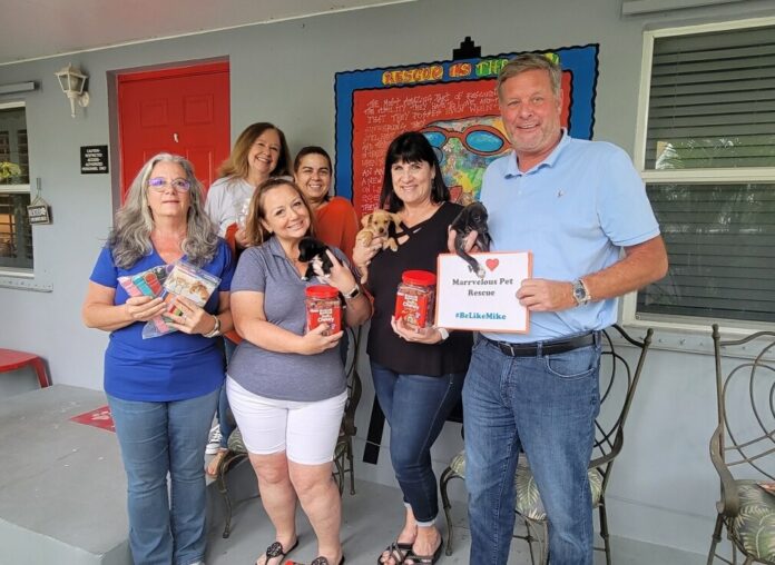 a group of people standing in front of a building