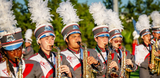 a group of men in uniform playing musical instruments