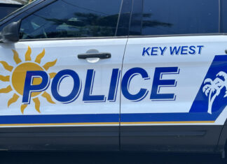 a key west police vehicle parked in a parking lot