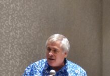 a man standing in front of a microphone