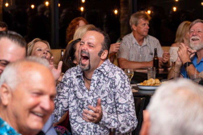 a group of people sitting around a table