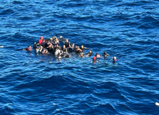a group of people riding on the back of a boat