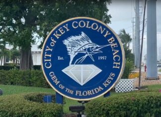 a sign for the city of key colony beach