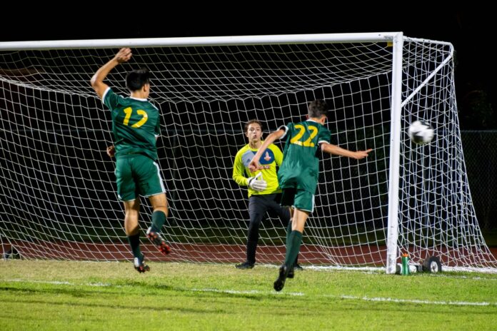 a group of young men playing a game of soccer