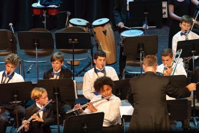a group of young men playing musical instruments