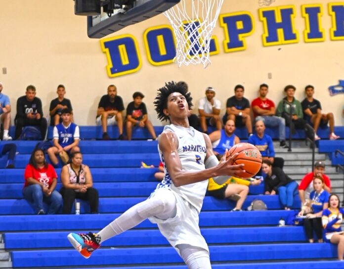 a man jumping up to dunk a basketball
