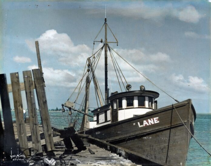 WorkingWaterfront_02 Large a boat sitting on top of a wooden dock