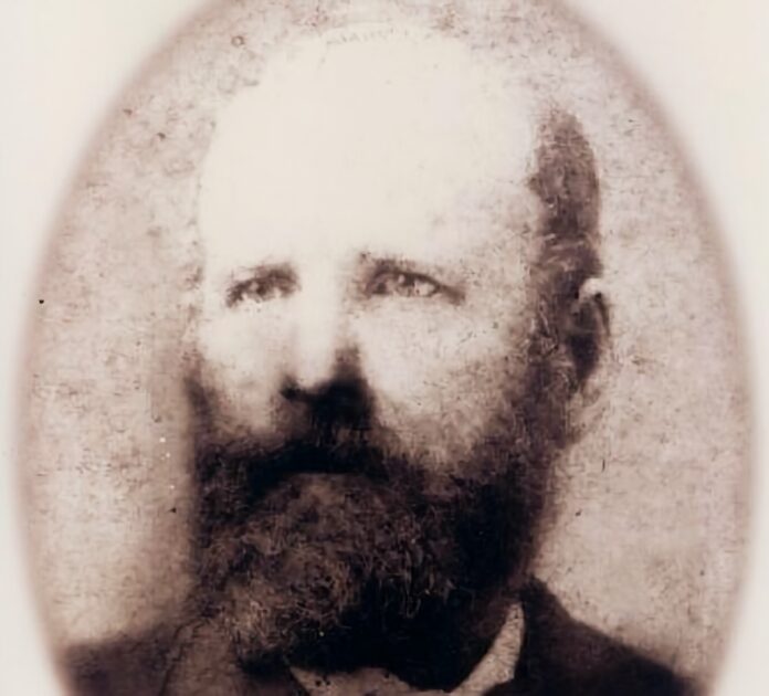 an old photo of a man with a beard