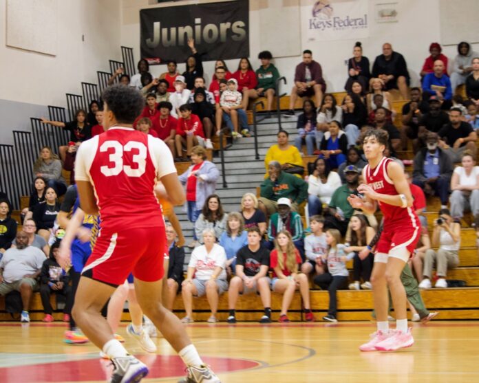 a group of young men playing a game of basketball