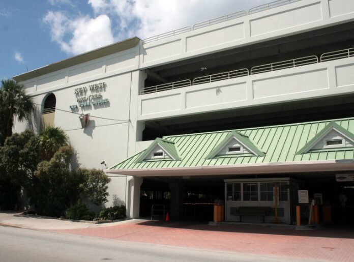 park n ride garage a large white building with a green roof