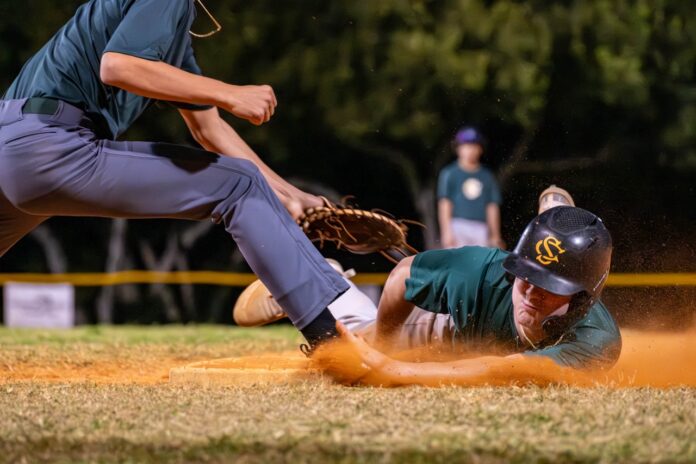 a baseball player sliding into a base during a game