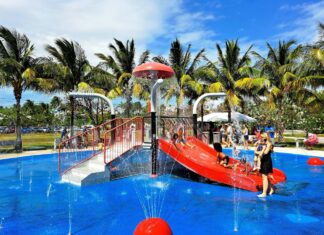 a children's water park with a red slide