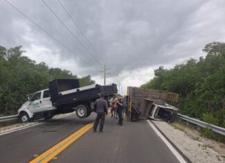 a truck that has crashed into a bridge
