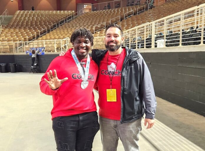 RR states a couple of men standing next to each other