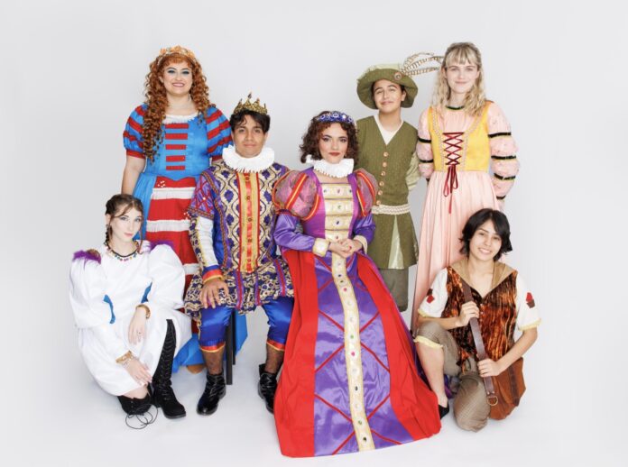 a group of people dressed in costume posing for a picture